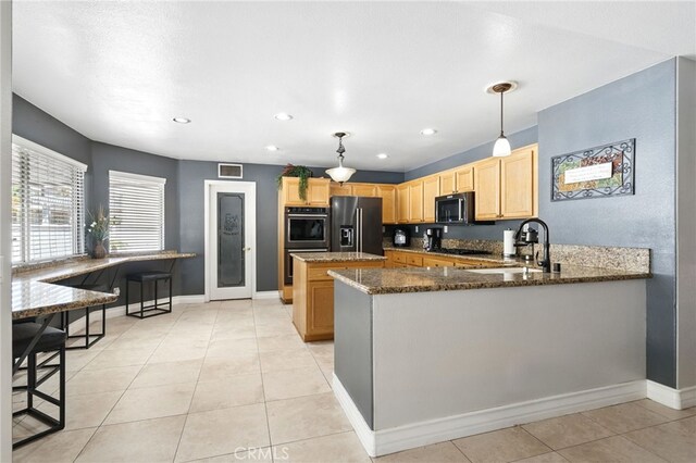 25 Del Brienza, Lake Elsinore, CA 92532 - kitchen with refrigerator with ice dispenser, light brown cabinetry, double oven, dark stone countertops, and light tile patterned flooring