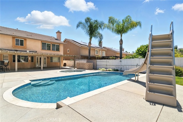 25 Del Brienza, Lake Elsinore, CA 92532 - view of pool featuring an in-ground hot tub, a water slide, a fenced backyard, a patio, and french doors