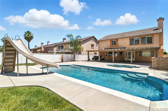 25 Del Brienza, Lake Elsinore, CA 92532 - view of swimming pool with an in-ground hot tub, a water slide, a patio, a fenced backyard, and a pergola