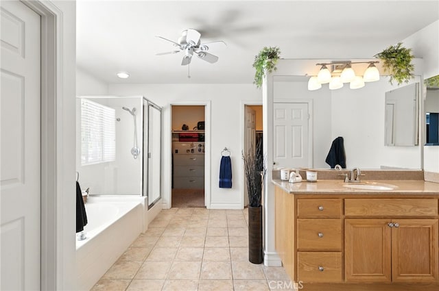 25 Del Brienza, Lake Elsinore, CA 92532 - bathroom with a shower stall, vanity, ceiling fan, a spacious closet, and a garden tub