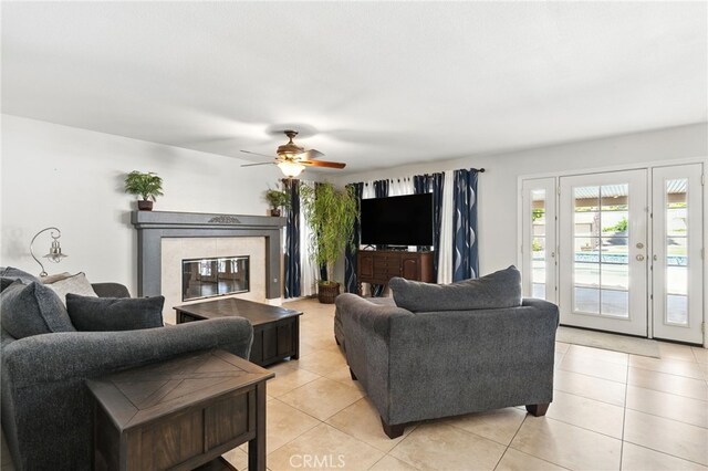 25 Del Brienza, Lake Elsinore, CA 92532 - living area featuring light tile patterned flooring, a tile fireplace, and ceiling fan