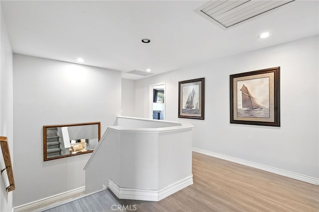 25 Del Brienza, Lake Elsinore, CA 92532 - corridor featuring an upstairs landing, light wood finished floors, and recessed lighting