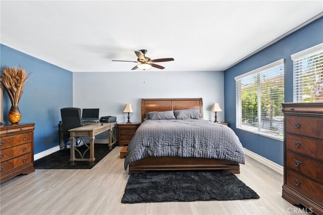 25 Del Brienza, Lake Elsinore, CA 92532 - bedroom with wood finished floors, a ceiling fan, and an office area