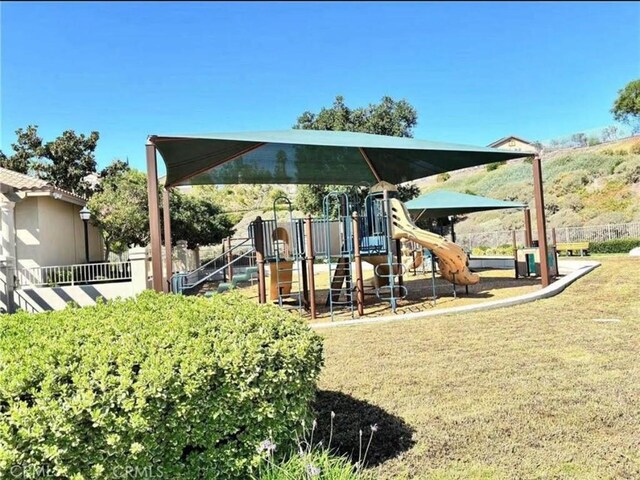 25 Del Brienza, Lake Elsinore, CA 92532 - view of jungle gym with a lawn