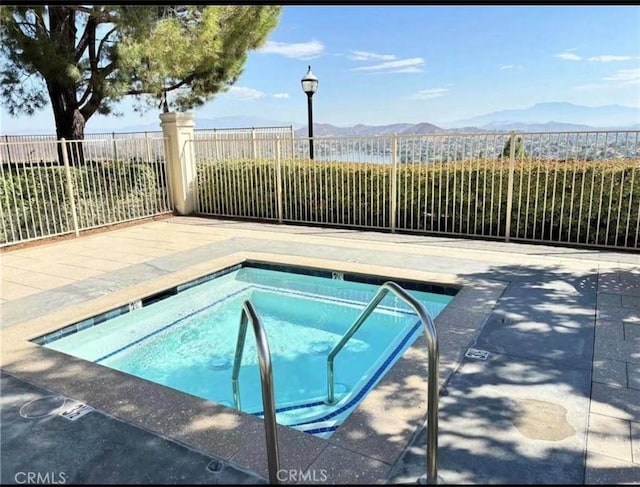 25 Del Brienza, Lake Elsinore, CA 92532 - view of pool with a hot tub, a mountain view, and a swimming pool