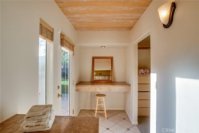 576 E Desert Holly Cir, Palm Springs, CA 92262 - interior space featuring wooden ceiling, tile patterned flooring, and baseboards