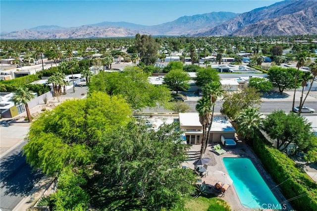 576 E Desert Holly Cir, Palm Springs, CA 92262 - aerial perspective of suburban area featuring mountains and a pool