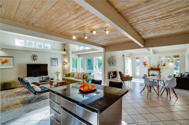 576 E Desert Holly Cir, Palm Springs, CA 92262 - living area with light tile patterned floors and wooden ceiling with exposed beams