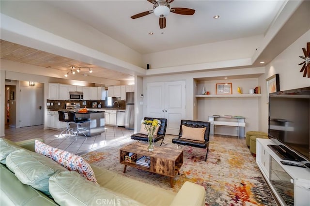 576 E Desert Holly Cir, Palm Springs, CA 92262 - living area with ceiling fan, light tile patterned floors, recessed lighting, and built in shelves