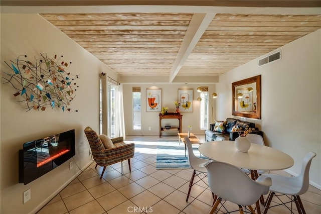 576 E Desert Holly Cir, Palm Springs, CA 92262 - dining room featuring light tile patterned flooring, wood ceiling with exposed beams, and baseboards