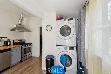 426 Ivy St, Glendale, CA 91204 - laundry area featuring stacked washer / dryer and light wood-type flooring
