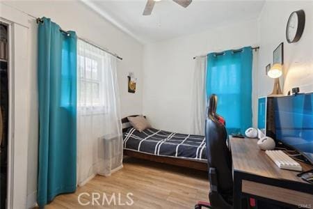 426 Ivy St, Glendale, CA 91204 - bedroom with wood finished floors, a ceiling fan, and a desk
