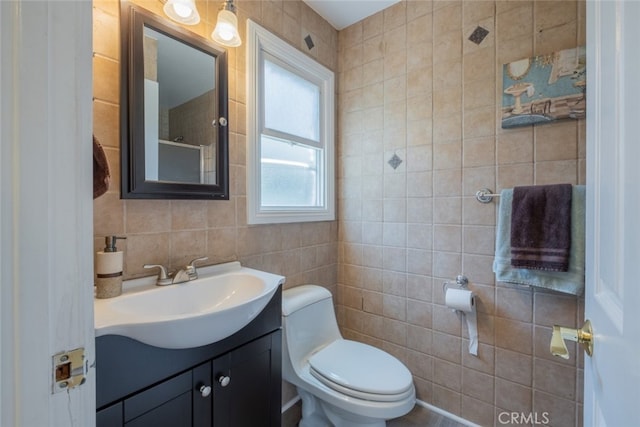 16732 Lassen St, Northridge, CA 91343 - bathroom featuring tile walls, vanity, and toilet