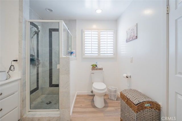 16732 Lassen St, Northridge, CA 91343 - bathroom featuring a shower stall, wood finished floors, toilet, and recessed lighting