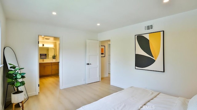 2737 Lorenzo Ave, Costa Mesa, CA 92626 - bedroom with light wood-style flooring, recessed lighting, ensuite bathroom, and baseboards