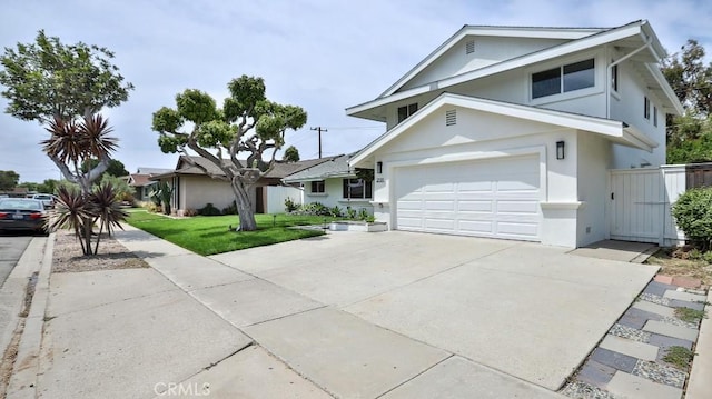 2737 Lorenzo Ave, Costa Mesa, CA 92626 - view of front of property featuring concrete driveway, stucco siding, and a gate