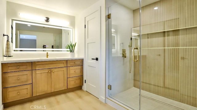 2737 Lorenzo Ave, Costa Mesa, CA 92626 - bathroom featuring vanity, wood finished floors, and a stall shower