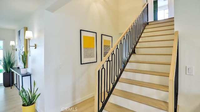 2737 Lorenzo Ave, Costa Mesa, CA 92626 - stairs featuring plenty of natural light, baseboards, and wood finished floors