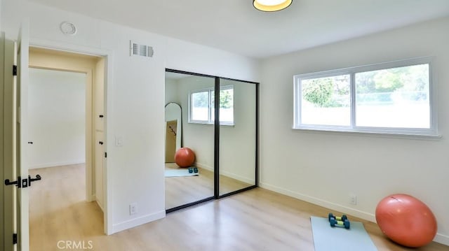 2737 Lorenzo Ave, Costa Mesa, CA 92626 - exercise room with light wood-type flooring and baseboards