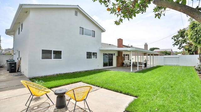 2737 Lorenzo Ave, Costa Mesa, CA 92626 - back of property featuring a patio area, stucco siding, and a chimney