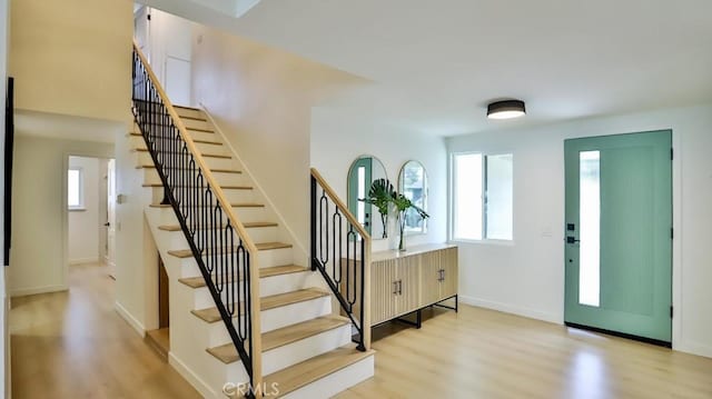 2737 Lorenzo Ave, Costa Mesa, CA 92626 - entrance foyer with stairs, light wood-style floors, and baseboards