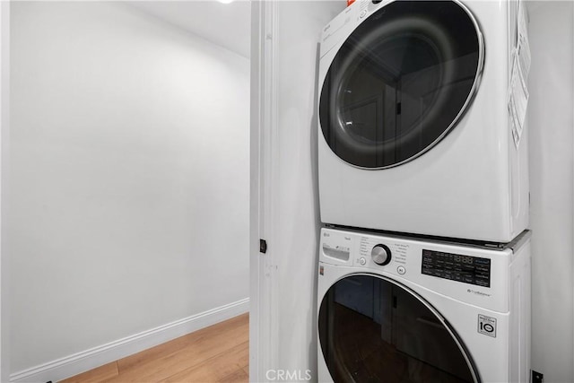 2716 Spreckels, Redondo Beach, CA 90278 - washroom with stacked washer / drying machine, light wood-style floors, and baseboards