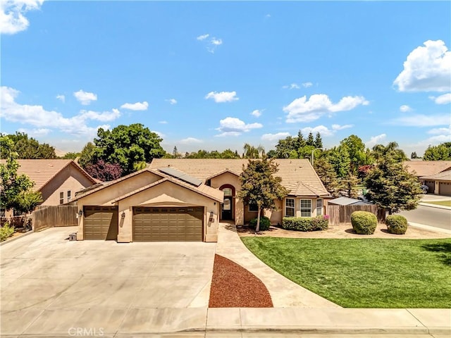 300 S Lombardi St, Porterville, CA 93257 - ranch-style house featuring an attached garage, stucco siding, concrete driveway, and a tile roof