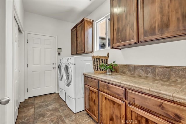 300 S Lombardi St, Porterville, CA 93257 - laundry room with washing machine and clothes dryer, cabinet space, and stone finish floors