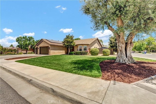 300 S Lombardi St, Porterville, CA 93257 - ranch-style home with an attached garage, solar panels, stucco siding, and driveway