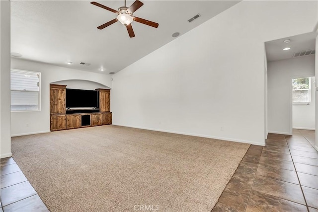 300 S Lombardi St, Porterville, CA 93257 - unfurnished living room with ceiling fan, baseboards, carpet, high vaulted ceiling, and tile patterned floors