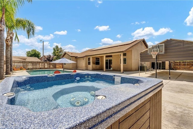 300 S Lombardi St, Porterville, CA 93257 - view of pool with a hot tub, a patio area, and a fenced backyard