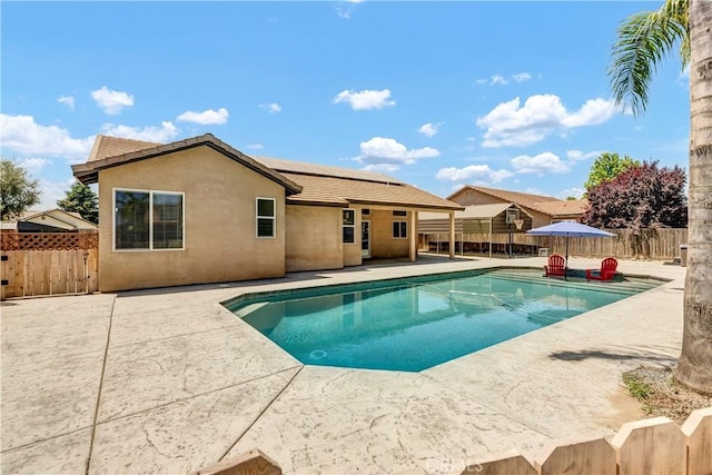 300 S Lombardi St, Porterville, CA 93257 - view of swimming pool featuring a patio and a fenced backyard
