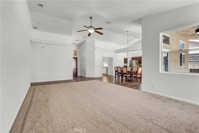 300 S Lombardi St, Porterville, CA 93257 - carpeted living room featuring a ceiling fan, baseboards, and high vaulted ceiling