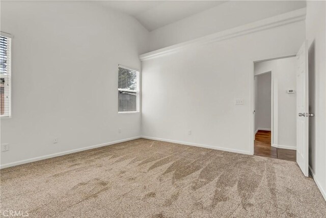 300 S Lombardi St, Porterville, CA 93257 - empty room with carpet floors, lofted ceiling, and baseboards