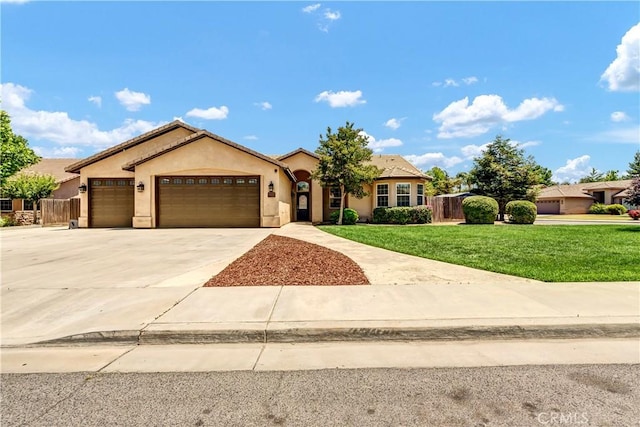300 S Lombardi St, Porterville, CA 93257 - view of front of home featuring a garage, stucco siding, and concrete driveway