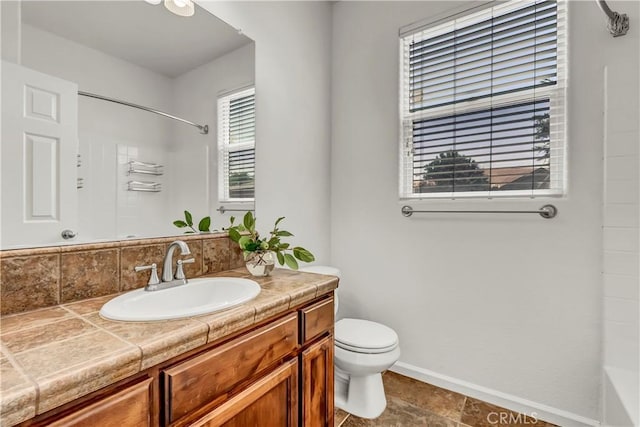 300 S Lombardi St, Porterville, CA 93257 - full bath with baseboards, toilet, vanity, and a shower
