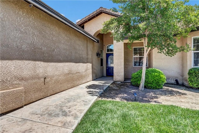 300 S Lombardi St, Porterville, CA 93257 - doorway to property featuring stucco siding