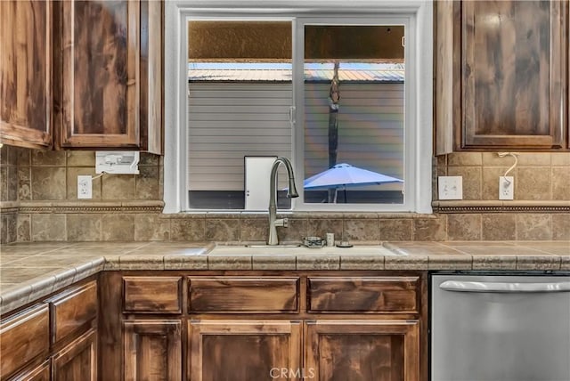 300 S Lombardi St, Porterville, CA 93257 - kitchen featuring stainless steel dishwasher, tasteful backsplash, and a sink