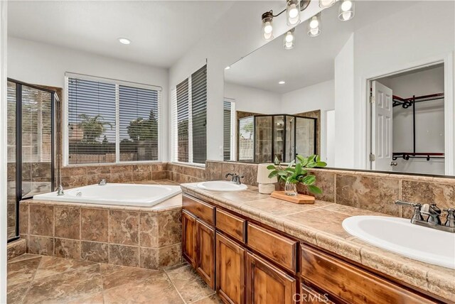 300 S Lombardi St, Porterville, CA 93257 - full bath with a stall shower, a bath, double vanity, and a walk in closet