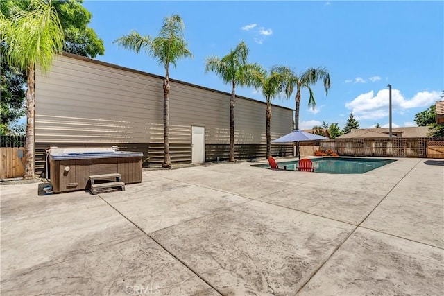300 S Lombardi St, Porterville, CA 93257 - view of pool featuring a hot tub, a patio, and a fenced backyard