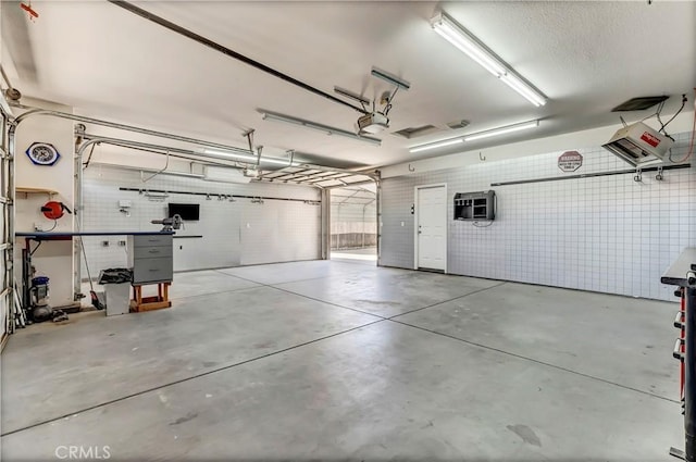 300 S Lombardi St, Porterville, CA 93257 - garage featuring a garage door opener