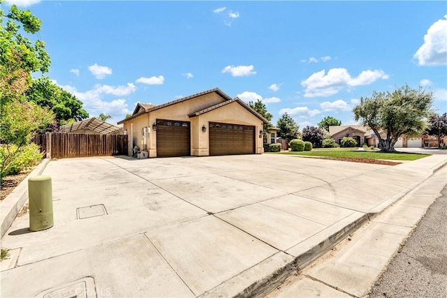 300 S Lombardi St, Porterville, CA 93257 - ranch-style home featuring an attached garage, driveway, and stucco siding