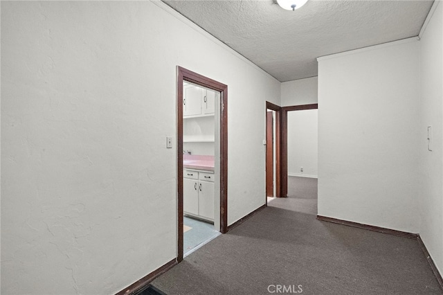 4251 E 4th St, Long Beach, CA 90814 - hall with a textured ceiling, dark colored carpet, and baseboards