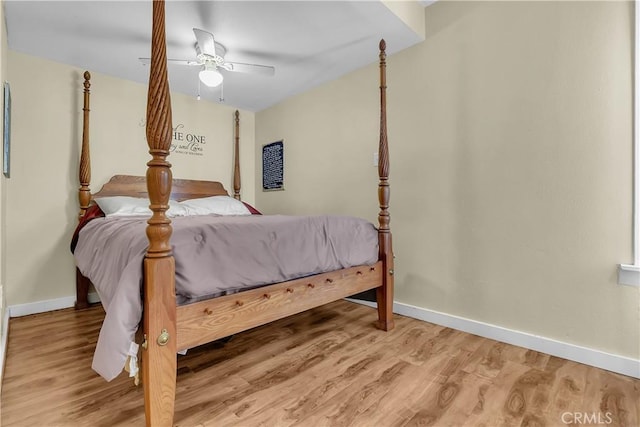 3875 Everest Ave, Riverside, CA 92503 - bedroom featuring baseboards, wood finished floors, and ceiling fan