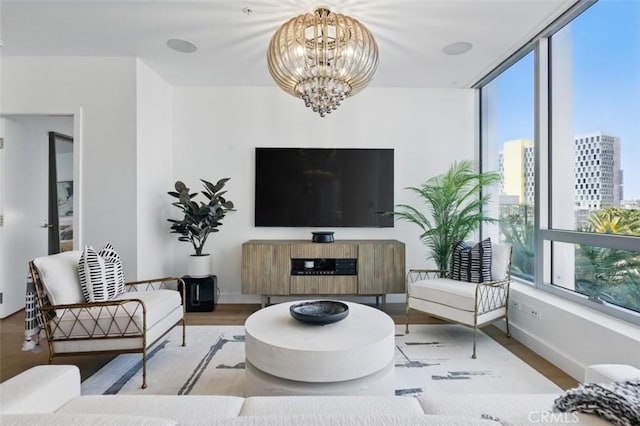 888 W E St Unit 505, San Diego, CA 92101 - living room with a chandelier, wood finished floors, and baseboards