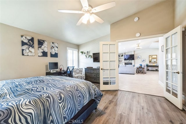 43300 Warner Trl, Palm Desert, CA 92211 - bedroom featuring vaulted ceiling, french doors, wood finished floors, and ceiling fan