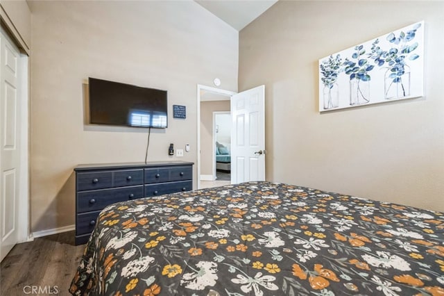 43300 Warner Trl, Palm Desert, CA 92211 - bedroom with wood finished floors, baseboards, and high vaulted ceiling