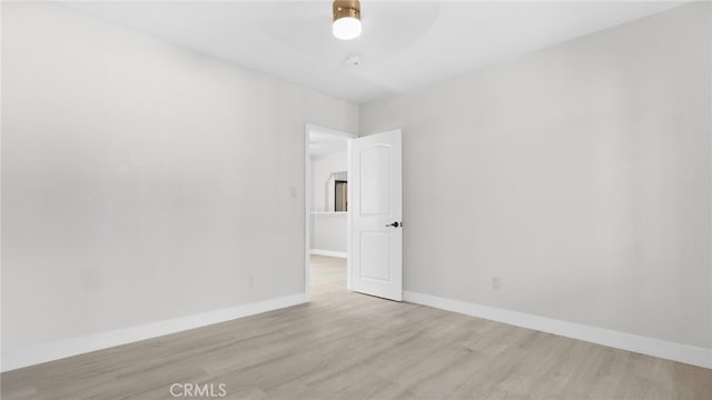 413 E 81st St, Los Angeles, CA 90003 - spare room featuring wood finished floors, baseboards, and a ceiling fan