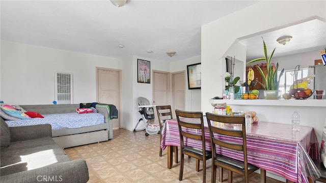 413 E 81st St, Los Angeles, CA 90003 - bedroom with light flooring, a heating unit, and freestanding refrigerator