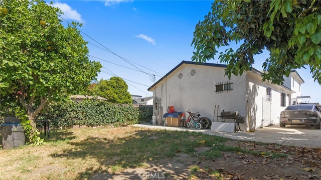 413 E 81st St, Los Angeles, CA 90003 - rear view of property featuring stucco siding